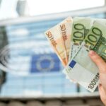 Holding euro banknotes